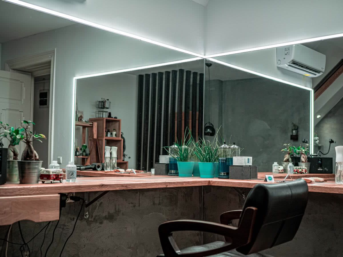 The Haze salon: the lit mirror and a styling station